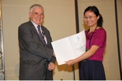 Dr Lili He receives a Young Scientist Award from IUFoST President Em Prof Geoffrey Campbell-Platt